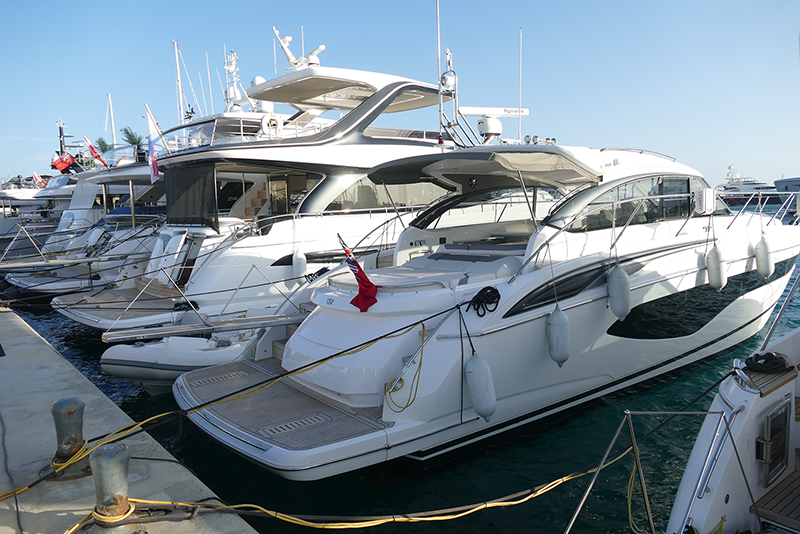 Boats on the water showcasing the importance of ignition-protected marine fuse blocks and electrical components for safety