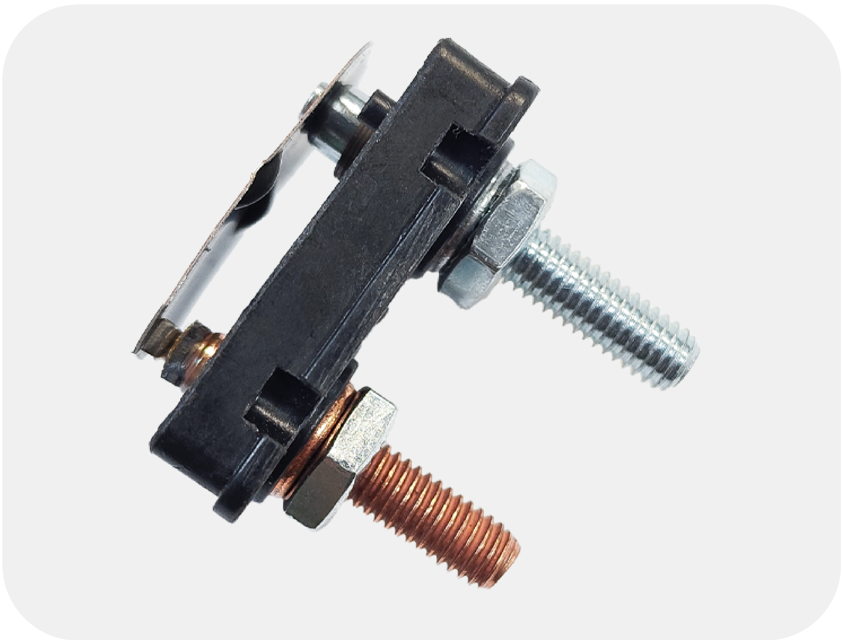 Close-up of a bimetal strip used in a thermal circuit breaker, showing how it bends when heated to interrupt current flow.