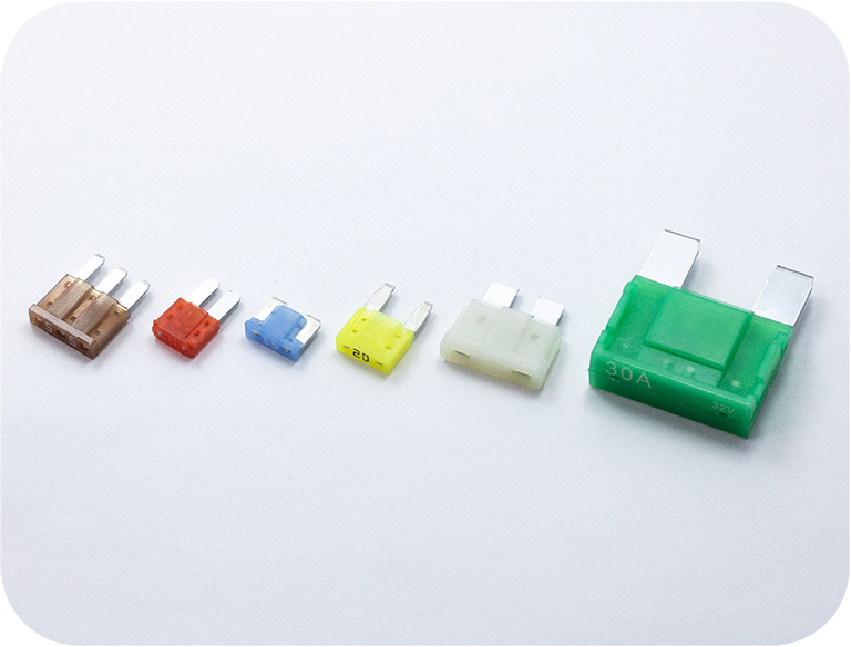 Various fuse types—blade, glass tube, ceramic, and bolt-on—used to protect circuits from overcurrent and short circuits.