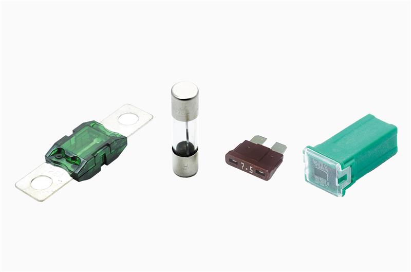 Visual comparison of four automotive fuses: blade, link, bolt-on, and glass, highlighting their shapes and applications.