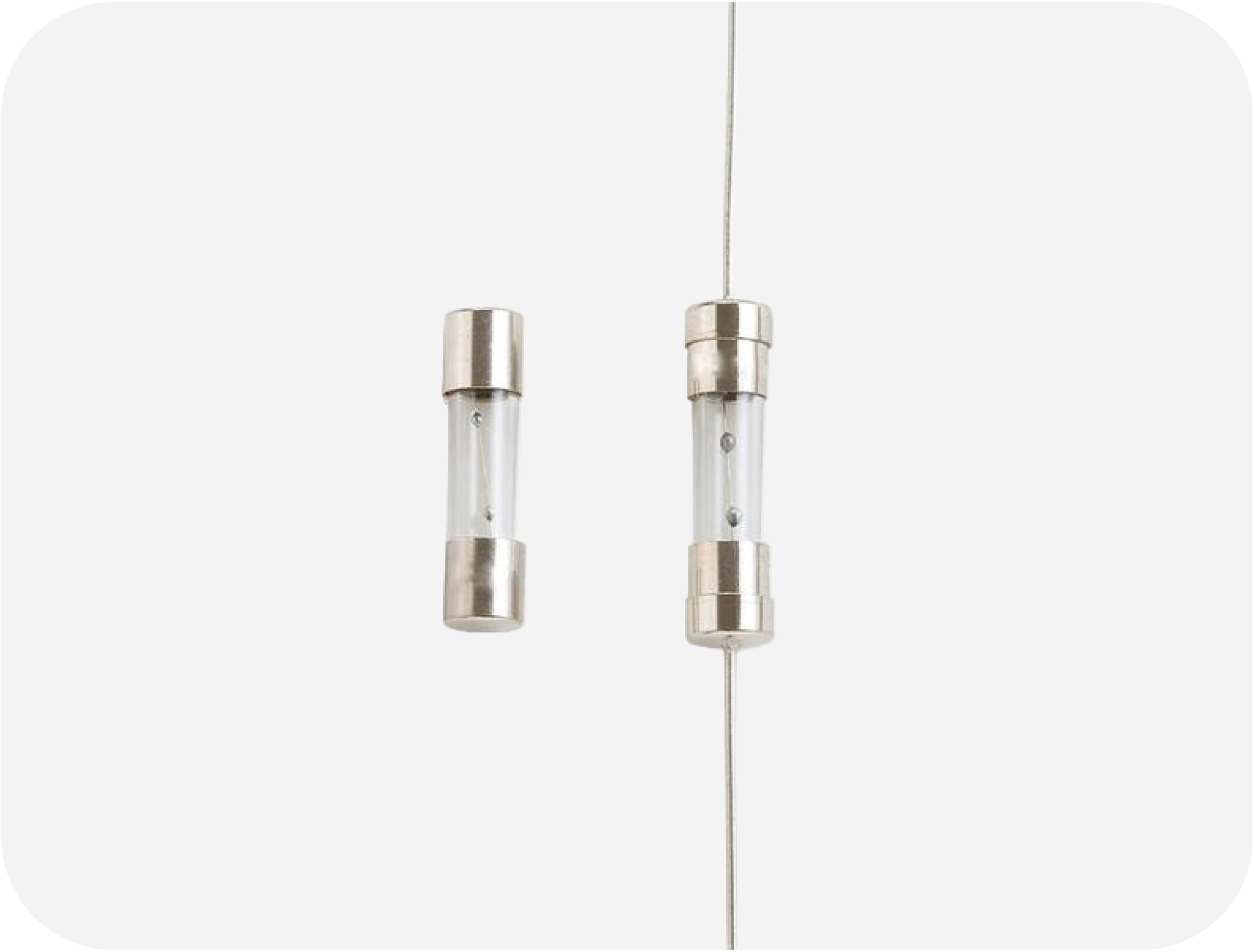 OptiFuse TSC 5×20mm time-lag glass tube fuse showing clear glass body and metal end caps; TSC-P axial lead version for PCB or wired mounting